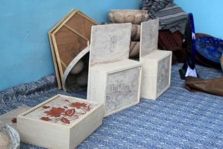 Traditional Kashmiri paper mache boxes and trays before the intervention