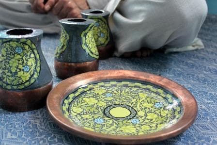 Finished hand-painted copper vases and plates with Kashmiri motifs